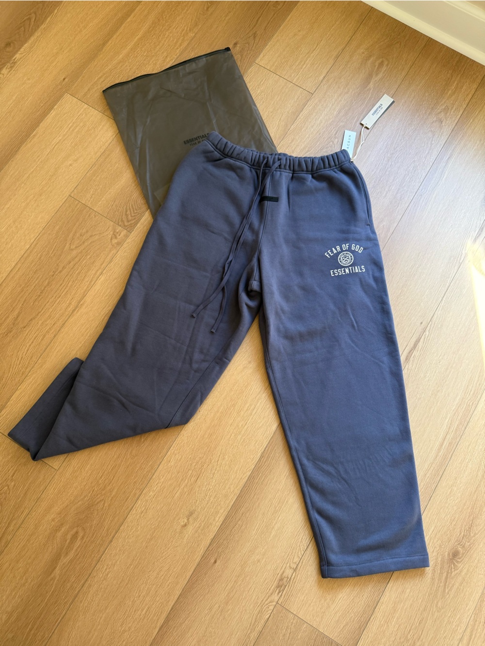 Essentials- Fear of God; Joggers in Slate Blue with White Print from PacSun